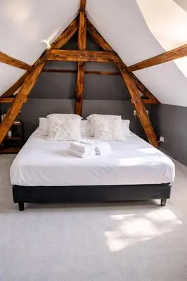 Un ou plusieurs lits dans un hébergement de l'établissement La maison au bord de la riviére