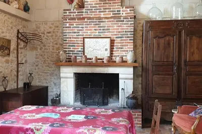 Un ou plusieurs lits dans un hébergement de l'établissement La Chauvellière, un écrin de verdure dans un cadre historique