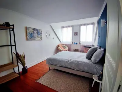 Un ou plusieurs lits dans un hébergement de l'établissement Le char'Mans appartement cosy proche gare et tram