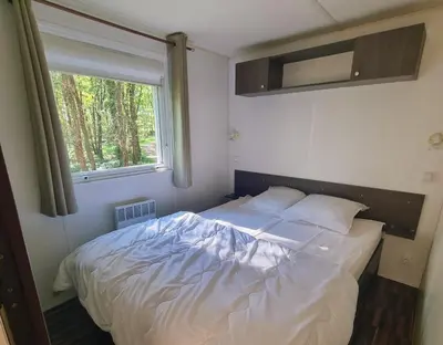Un ou plusieurs lits dans un hébergement de l'établissement Camping les petites minaudières