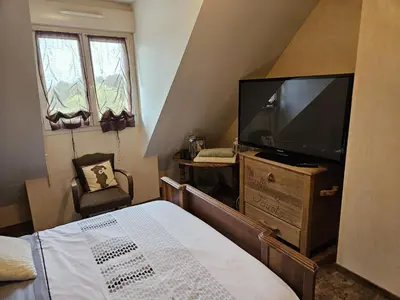 Télévision ou salle de divertissement dans l'établissement Séjour circuit 24h du Mans
