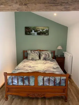 Un ou plusieurs lits dans un hébergement de l'établissement Appartement Cosy La Maison de Jean