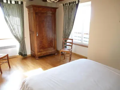 Un ou plusieurs lits dans un hébergement de l'établissement La maison d'angel