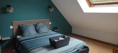 Un ou plusieurs lits dans un hébergement de l'établissement Location chambre au calme proche circuit des 24 heures