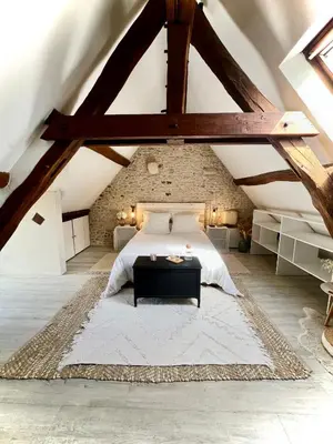 Un ou plusieurs lits dans un hébergement de l'établissement Le Cottage des Chalands