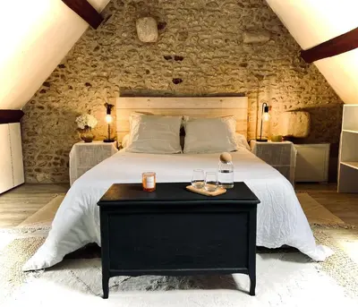 Un ou plusieurs lits dans un hébergement de l'établissement Le Cottage des Chalands