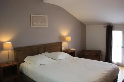 Un ou plusieurs lits dans un hébergement de l'établissement Villa Le Printemps, maison 15 pers avec piscine
