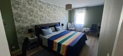 Un ou plusieurs lits dans un hébergement de l'établissement Maison au calme a Arnage