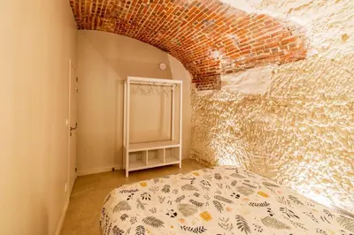 Un ou plusieurs lits dans un hébergement de l'établissement Gîte troglodyte - Troglo du Pontcher