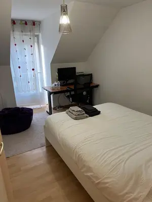 Un ou plusieurs lits dans un hébergement de l'établissement Chambres dans maison familiale