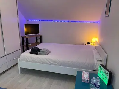 Un ou plusieurs lits dans un hébergement de l'établissement Chambres dans maison familiale