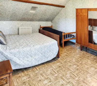 Un ou plusieurs lits dans un hébergement de l'établissement Chaleureuse Maison de Campagne avec Terrasse et Cheminée