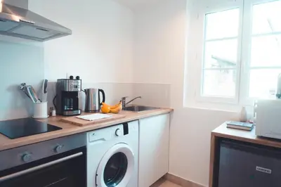 Cuisine ou kitchenette dans l'établissement L Étoile Filante - 2 pièces de caractère