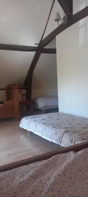 Un ou plusieurs lits dans un hébergement de l'établissement Les Grands Bois à BOUSSE