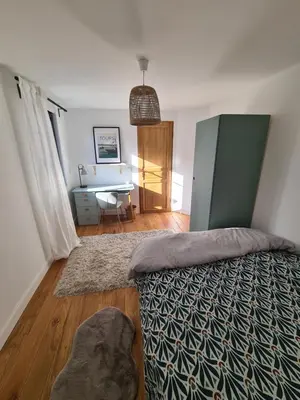 Un ou plusieurs lits dans un hébergement de l'établissement Gite Au Coeur de Tours, familial avec jardin au calme, parking